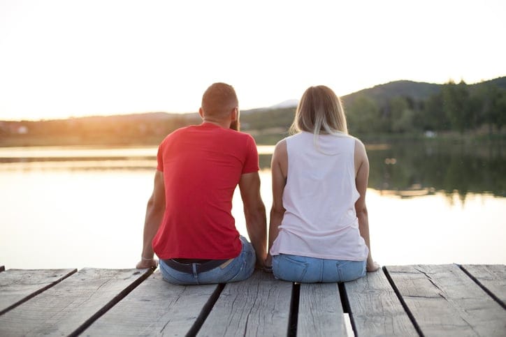 Romantic Couple sitting on the pier