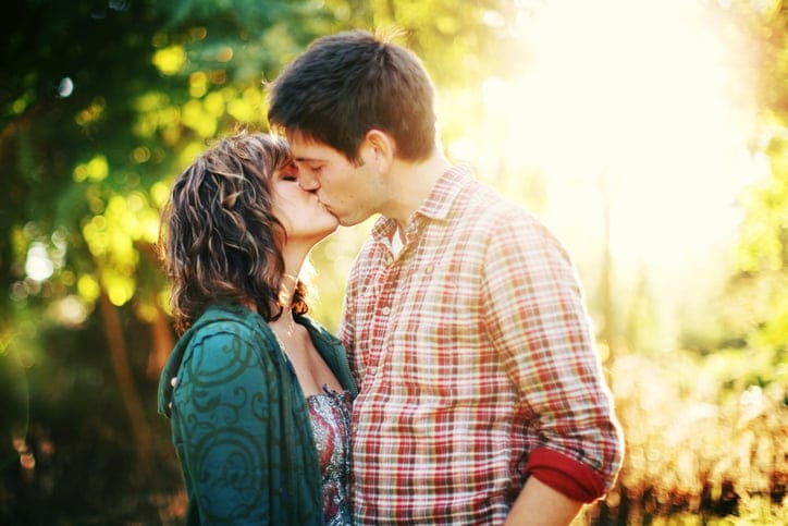 Autumn Sunset Couple Kissing in Forest