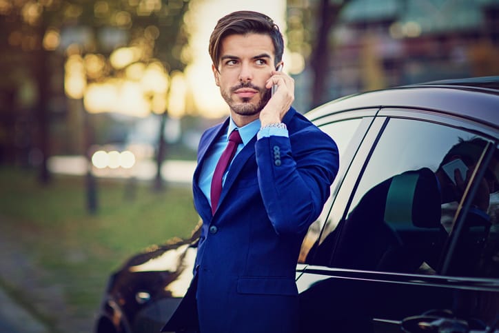Young businessman is talking on his mobile phone.