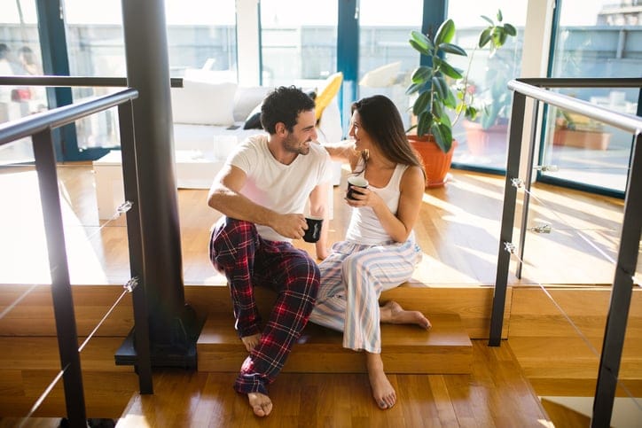 Couple in love enjoying morning coffee and flirting
