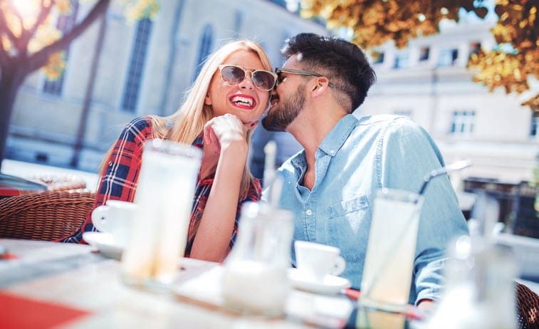 Meeting in the cafe. Romantic couple drinking coffee and lemonade, having a date in the cafe. Dating, love, relationships