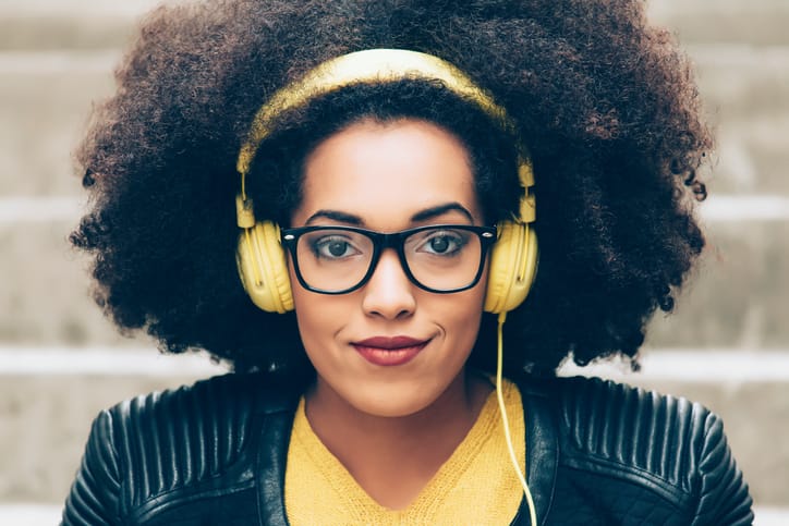 Young woman listening with headphones.