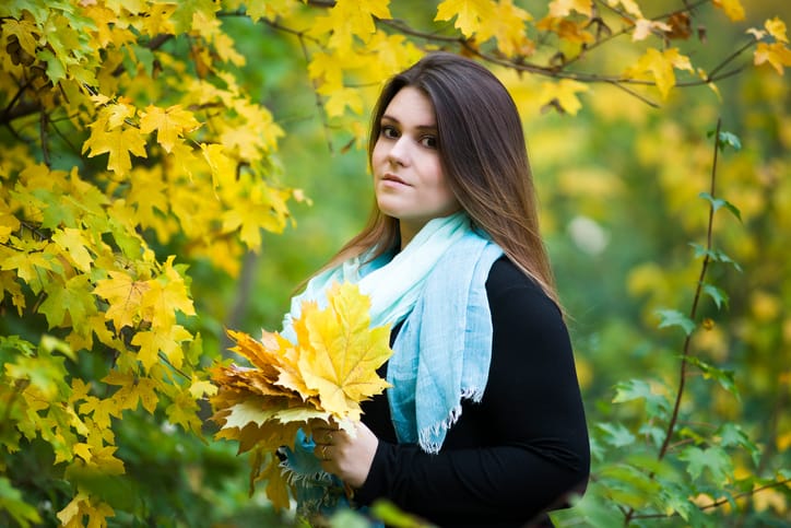 Plus size model outdoors, xxl woman on nature, autumn atmosphere