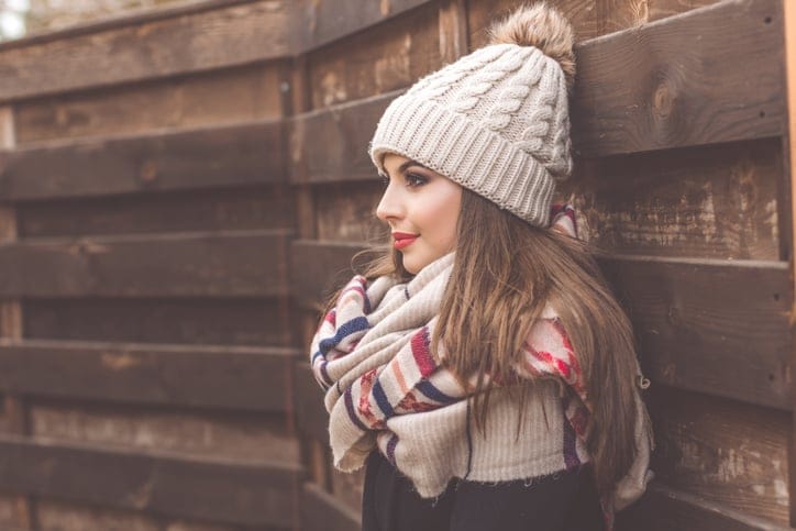 Pretty girl is wearing warm winter clothes
