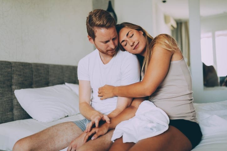 Couple in love bonding and enjoying romance in morning