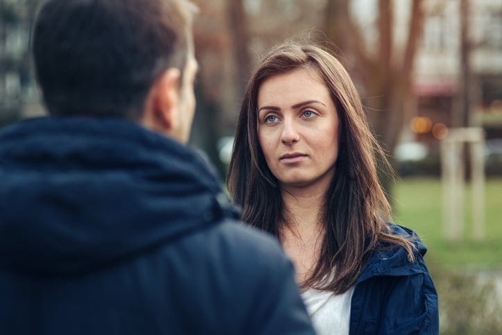 Couple arguing outside in the park