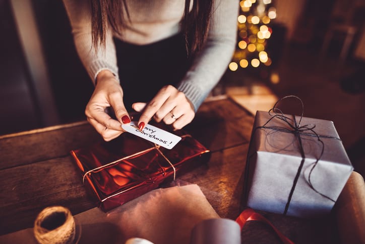 woman making the package for the christmas gift