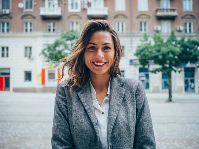 Beautiful happy woman taking a walk outdoors.