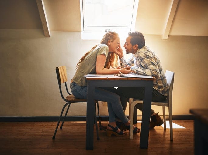 Shot of a young couple spending time together at a cafe