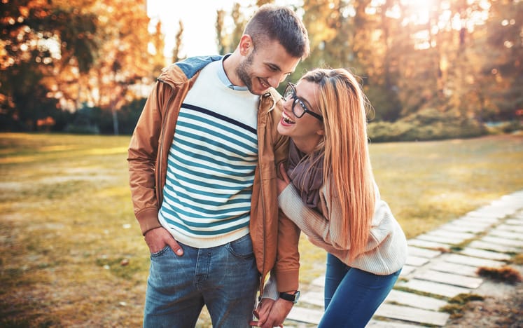 Meeting in the park. Romantic couple in the autumn park. Love, dating, romance