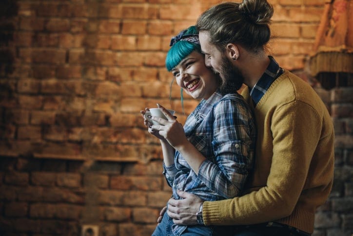 Happy couple enjoying in their love in a cafe.