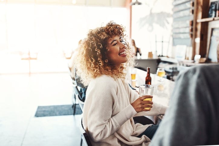 african american woman smiling at her desk