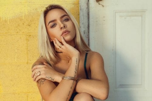 Blonde sitting down