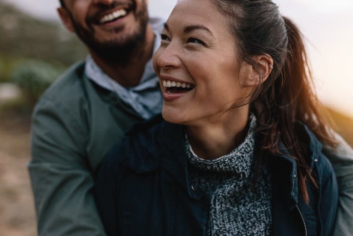 young couple laughing out loud