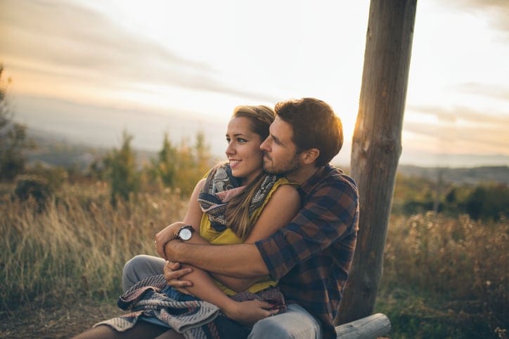 Couple enjoying a sunny day in late summer outdoors in nature
