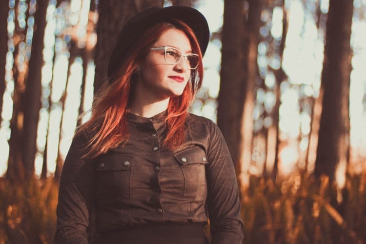 red haired glasses woman