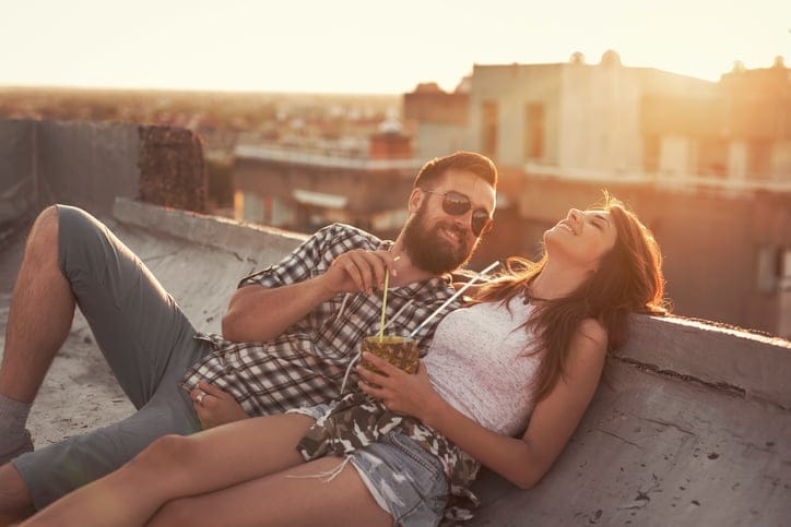 Couple enjoying summertime rooftop party