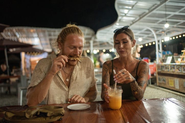 hipster couple at night market