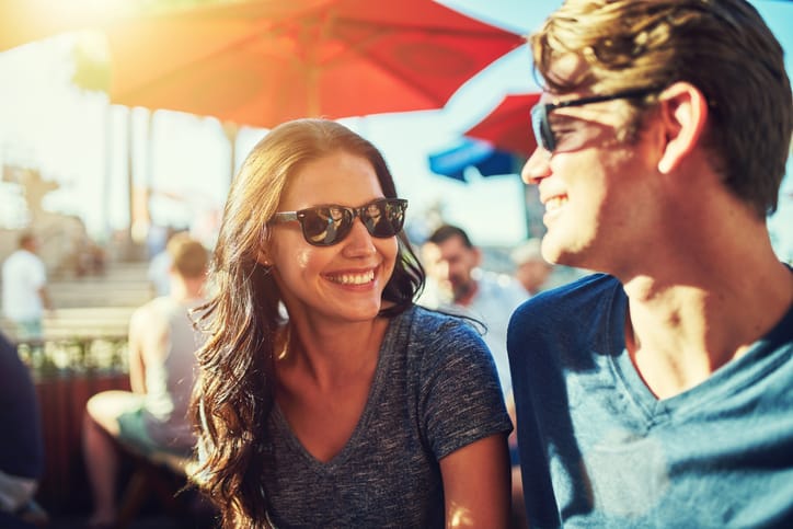 happy dating couple at outdoor restaurant