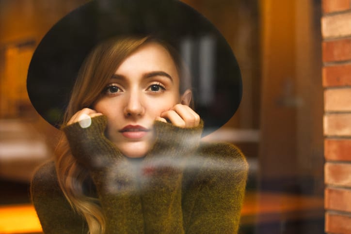 woman sitting with head in hands
