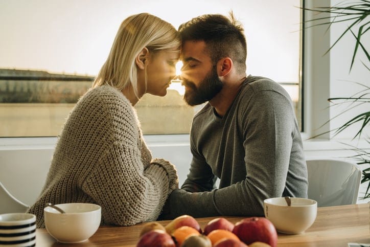 romantic couple touching foreheads
