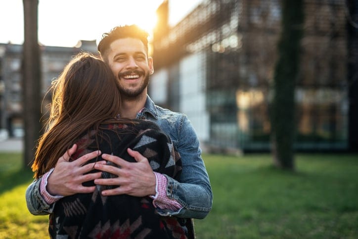 couple embracing outside
