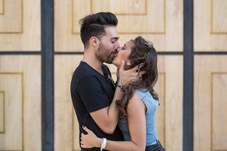 couple kissing outside