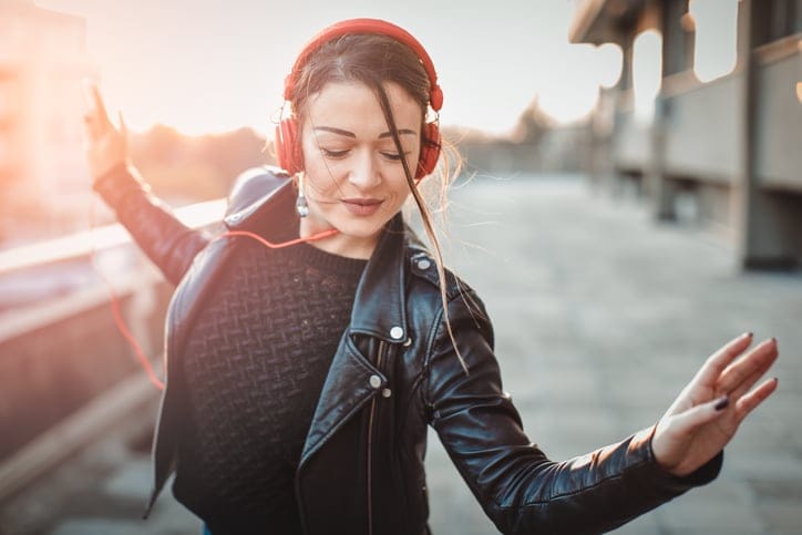 woman with headphones outdoors