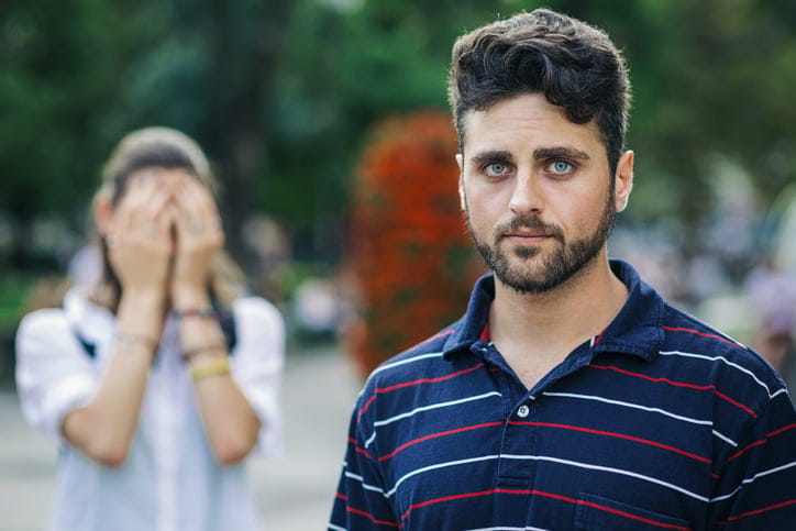 Couple having problems outside on the street