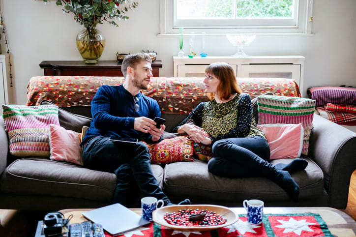 couple sitting at home chatting