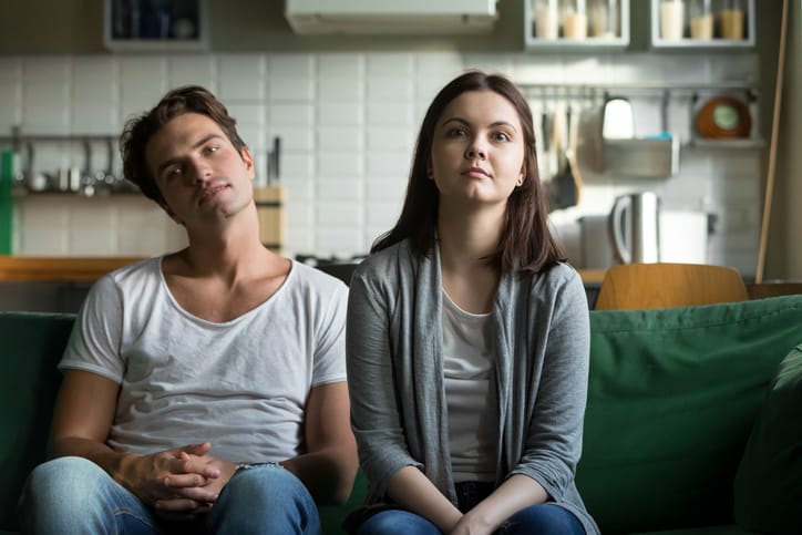 Woman and man in an argument at home.