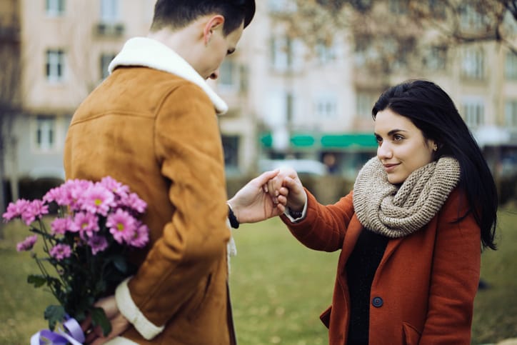 Young man surprising his girlfriend on Valentine's day