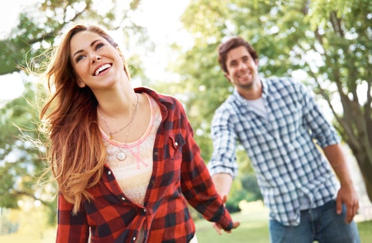 couple in plaid laughing and smiling together