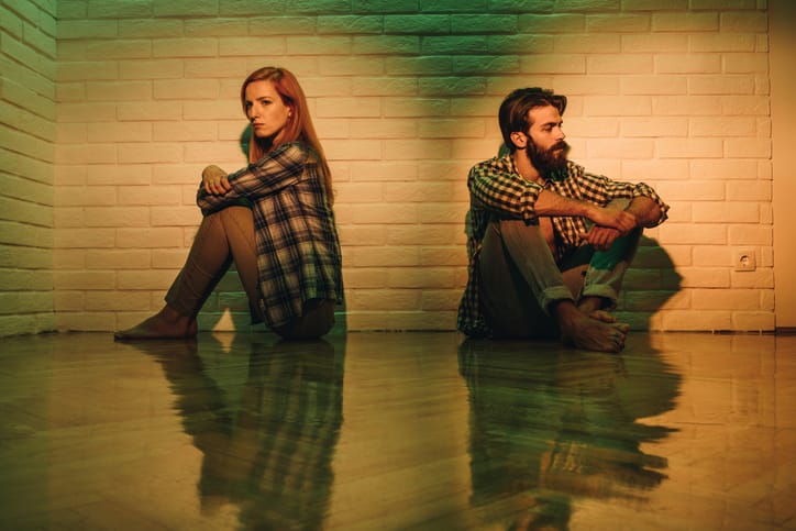 Displeased couple having problems in their relationship about to break up.