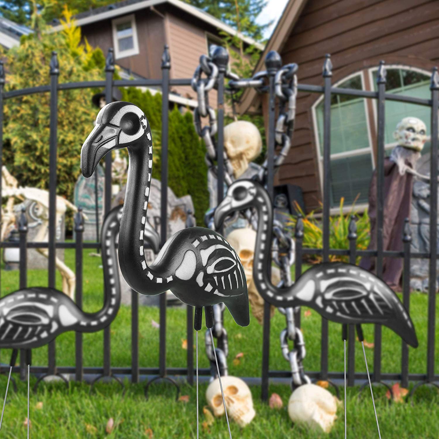 skeleton lawn flamingos