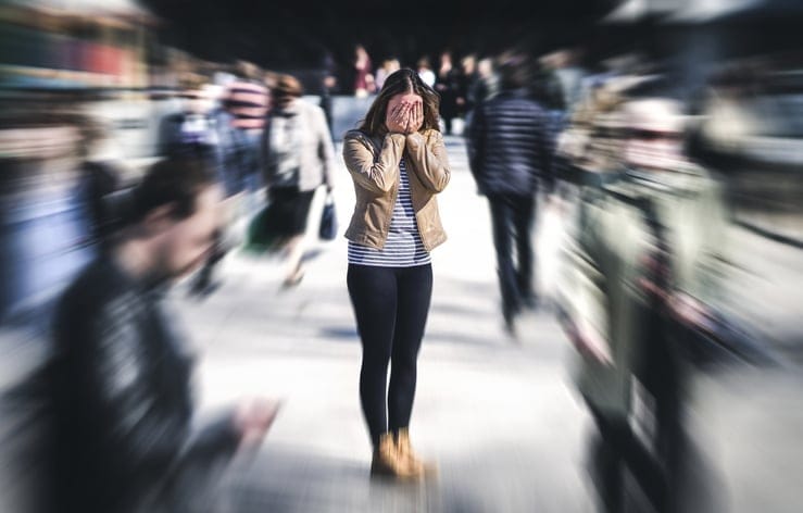 Woman having a panic attack on the street.