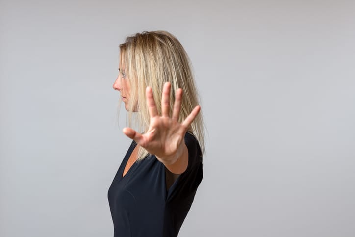A woman showing dislike toward someone.