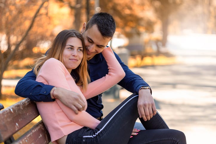 Couple having an uncomfortable hug
