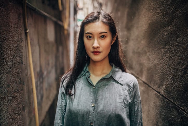 long haired asian woman facing camera