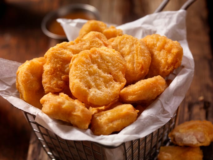 Chicken nuggets in a basket.