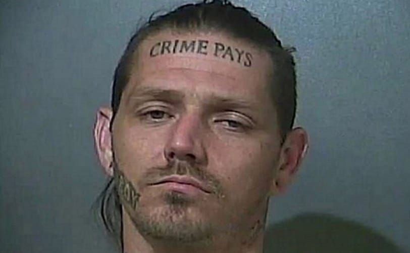 crime pays tattoo