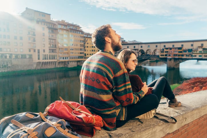 Young heterosexual couple resting with view