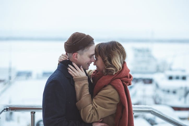 couple kissing in the snow