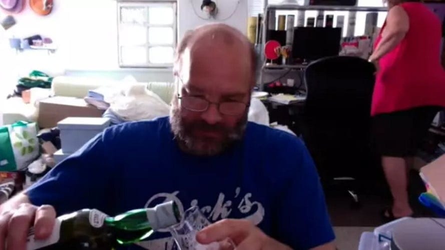 Guy Reviews Scotch While His Wife Packs Her Stuff And Leaves Him In The Background