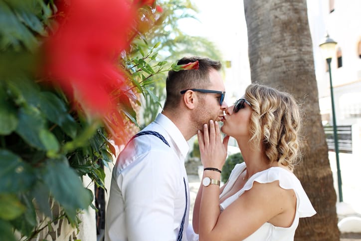 young couple kissing outside