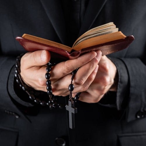priest holding bible