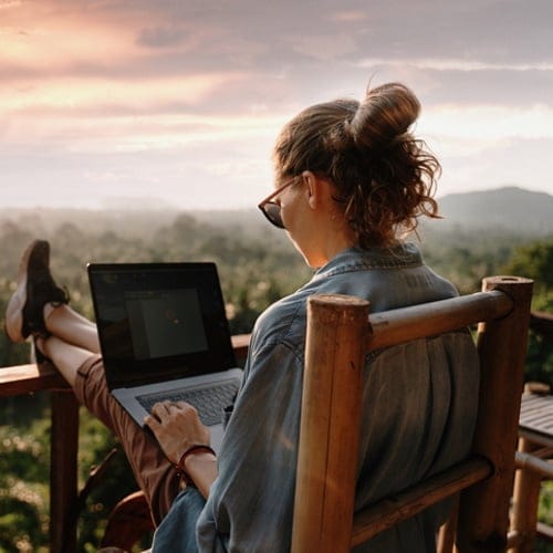 woman using laptop outside