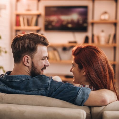 couple sitting at home on the sofa