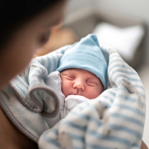 Woman holding her baby boy.