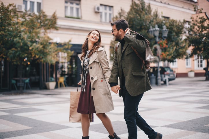 couple walking down the street together